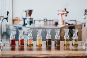 assorted glass with tea labeled on top of table inside the room