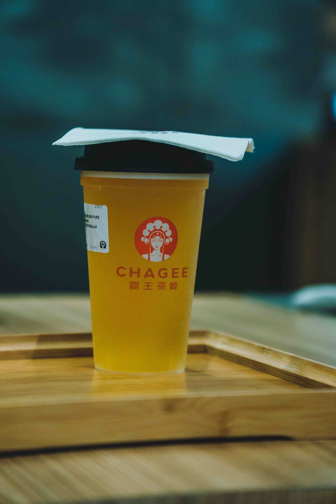 A cup of coffee sitting on top of a wooden tray